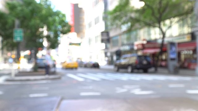 Manhattan defocused: intersection of Broadway and W55th street, yellow cabs, cars and pedestrians