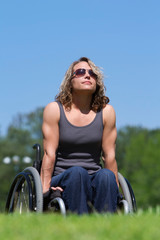 Fototapeta na wymiar Woman in wheelchair at park