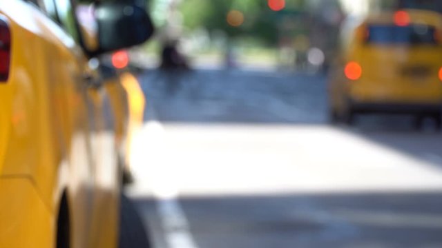 New York City motion background: Yellow cabs and traffic on a defocused NYC avenue