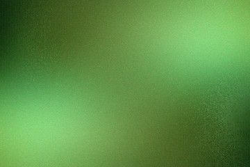 Brushed dark green metallic wall with scratched surface, abstract texture background