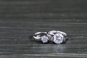 Diamond wedding rings on black background