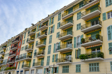 Fototapeta premium Colourful buildings with balconies by Nice old port in France