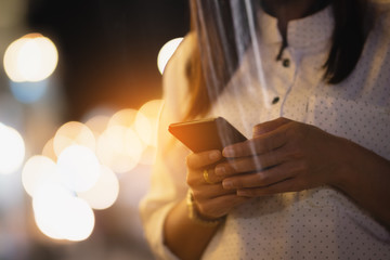 Asia woman using smartphone working,playing with happy
