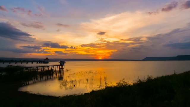 Day to night time lapse of sunset at Lum Chae dam, Khonburi, Nakhon Ratchasima, Thailand