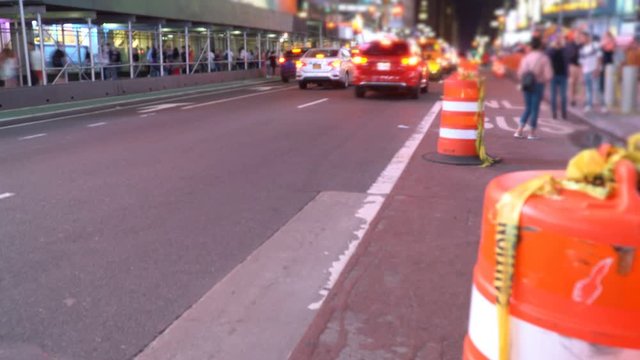 Times Square traffic timelapse, shot with long exposure, blurry background of New York City traffic at night