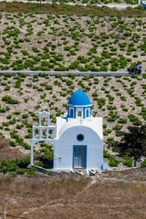 Vineyards and the Holy Trinity Church located in Akrotiri village on the Santorini Island