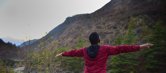 Travel Inspiration, Man standing in front of Mountains, Travel Motivation, Bhutan Trek, Trek in Bhutan