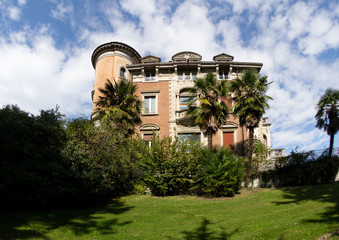 Facade of Villa Toeplitz; romantic building surrounded by a beautiful park. Varese - Italy