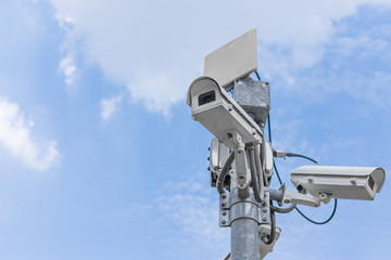 CCTV on the blue sky background  With buildings in the city