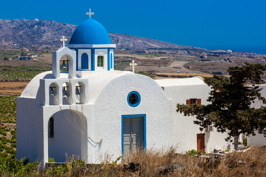 Vineyards and the Holy Trinity Church located in Akrotiri village on the Santorini Island