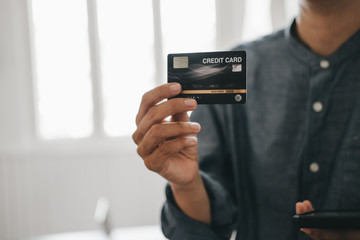 beautiful woman holding credit card using smartphone enjoy shopping website online, shopping concept.