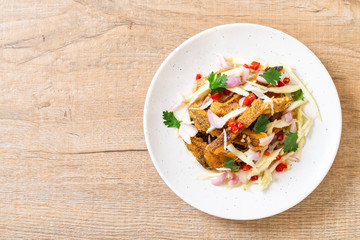 crispy gourami fish with spicy salad
