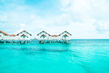 Beautiful tropical Maldives resort hotel and island with beach and sea