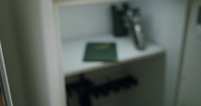 A weapons possession card placed into a gun safe.