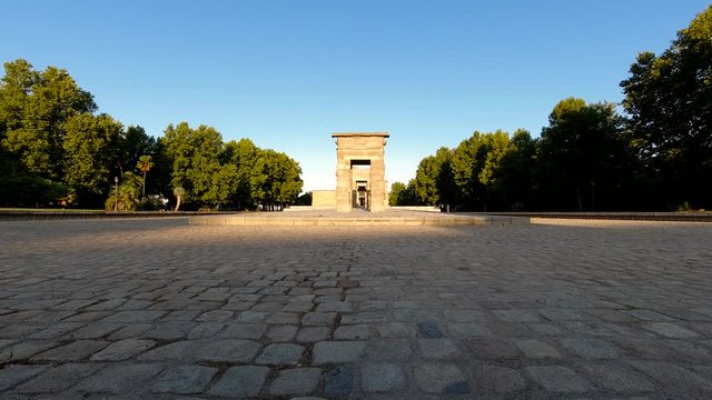 Frontal time lapse over Egyptian Temple of Debod in Madrid Spain with shadows being revealed