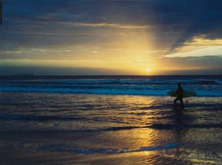 sunset surfer pacific ocean pier