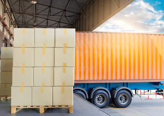 stack cardboard boxes on wooden pallets at distribution warehouse, the truck container docking load cargo shipment, freight industry warehouse, logistics and transport.