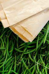 Fototapeta na wymiar long bean with paper bag sold in market