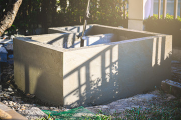 A small fish pond with built-in filter ponds during the construction of masonry and plastering