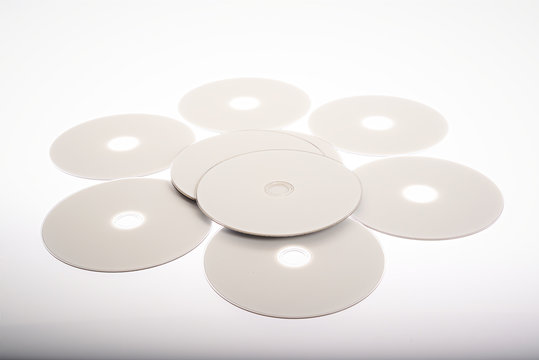a group of blue-ray disk on white background