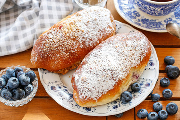 Traditional buns with blueberry filling.