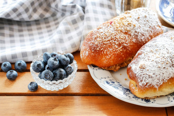 Traditional buns with blueberry filling.