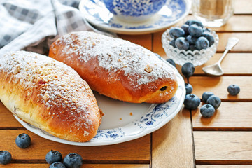 Traditional buns with blueberry filling.