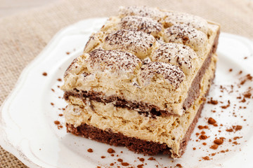 Portion of traditional italian tiramisu cake.