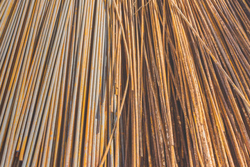 Background texture of old rusty steel bars construction materials in a construction site