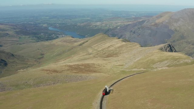 Steam train heritage railway in the mountains aerial