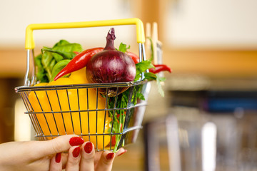 Shopping backet with dieting vegetables