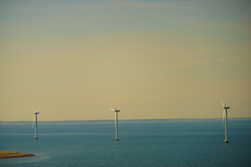 wind turbines farm on coast