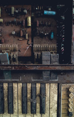 The piano vintage with electronic dilapidated in storage room