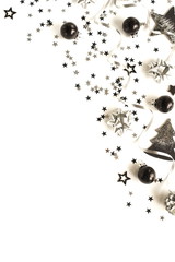 christmas or new year decorations background in silver black colors on white   background with empty copy space for text. holiday and celebration concept for postcard or invitation. top view 