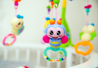 Children's toys hanging over the baby's crib