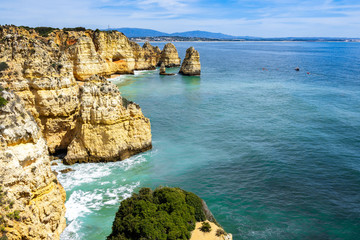 Fototapeta premium Scenic natural landscape of Algarve coastline near Lagos with cliffs overlooking the Atlantic Ocean, Portugal