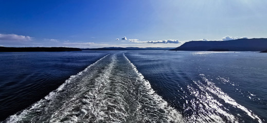 Wake Behind a Ferry Ship Boat on the Ocean Wide Angle