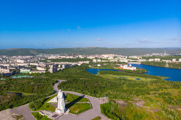 Murmansk, Russia - July 1, 2019: Aerial view panorama of city monument Defenders of Soviet Arctic Alyosha