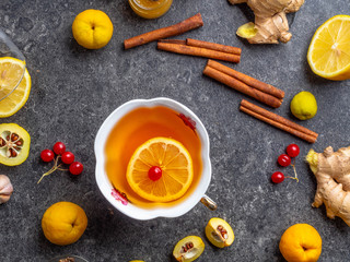 Cup of ginger hot tea with lemon and honey, cinnamon. autumn or winter drink