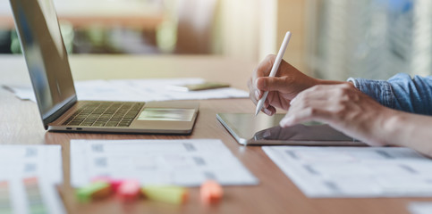 Close-up view of passionate UX web designer team planing interface project together