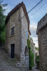 House shaped bow boat in an stone alley of the village of Labeaume, Ardeche, France.