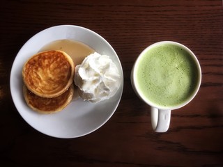 cup of tea with sweet pancakes