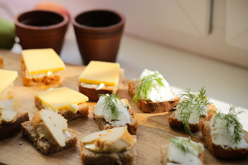 Breakfast useful porridge and sandwiches is on the table