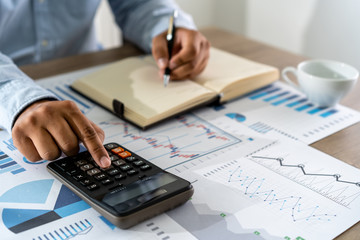 Fototapeta premium businessman working using a calculator finance accounting concept achievement to balance man assistant accounting