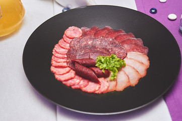 Colorful and appetizing cold cuts and salads
