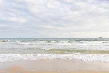 Fototapeta na wymiar Empty beach and tropical sea with beautiful sky background.
