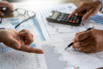 businessman working using a calculator finance accounting concept achievement to balance man assistant accounting