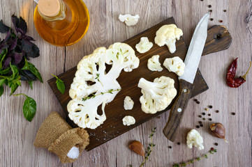 Fototapeta na wymiar Cauliflower on a cutting board. A beautiful cut of cauliflower. Healthy vegetable. The top view