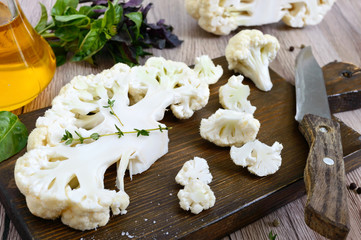 Cauliflower on a cutting board. A beautiful cut of cauliflower. Healthy vegetable.