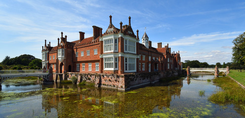  Helminngham Hall with moat bridges and reflections.